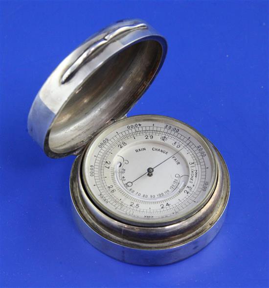 A late Victorian silver cased brass pocket barometer, 2.25in.